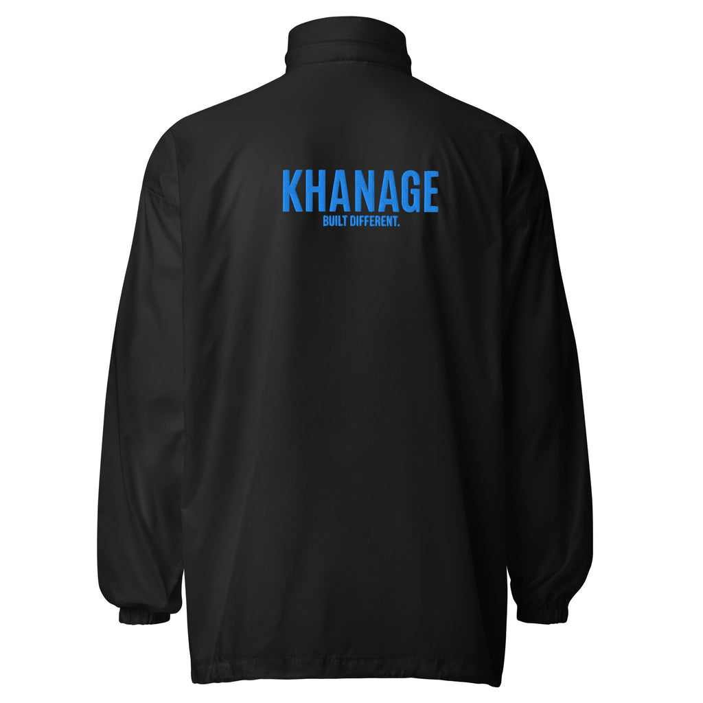 Rear view of KHANAGE Collective cobalt blue windbreaker — lightweight premium jacket