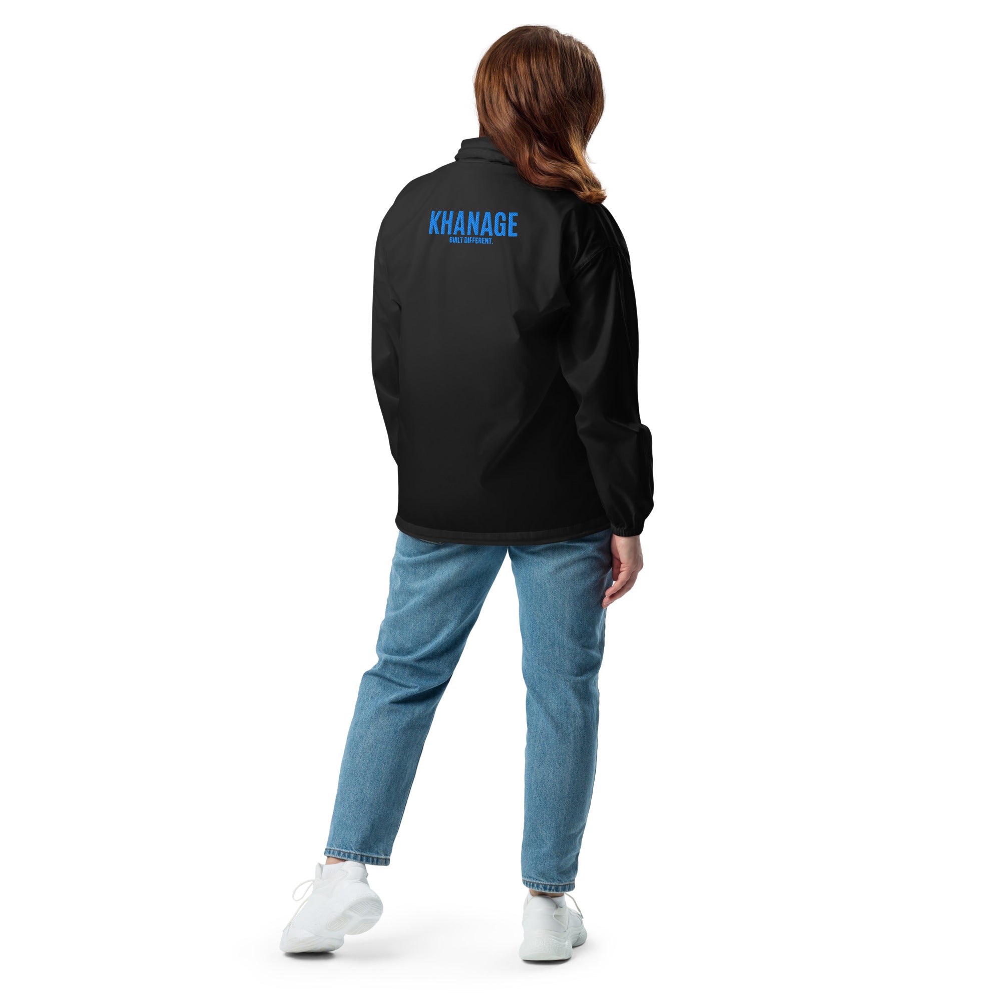 Rear view of KHANAGE Collective cobalt blue windbreaker — lightweight premium jacket