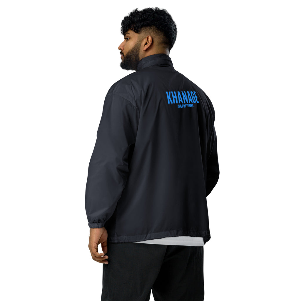 Rear view of KHANAGE Collective cobalt blue windbreaker — lightweight premium jacket