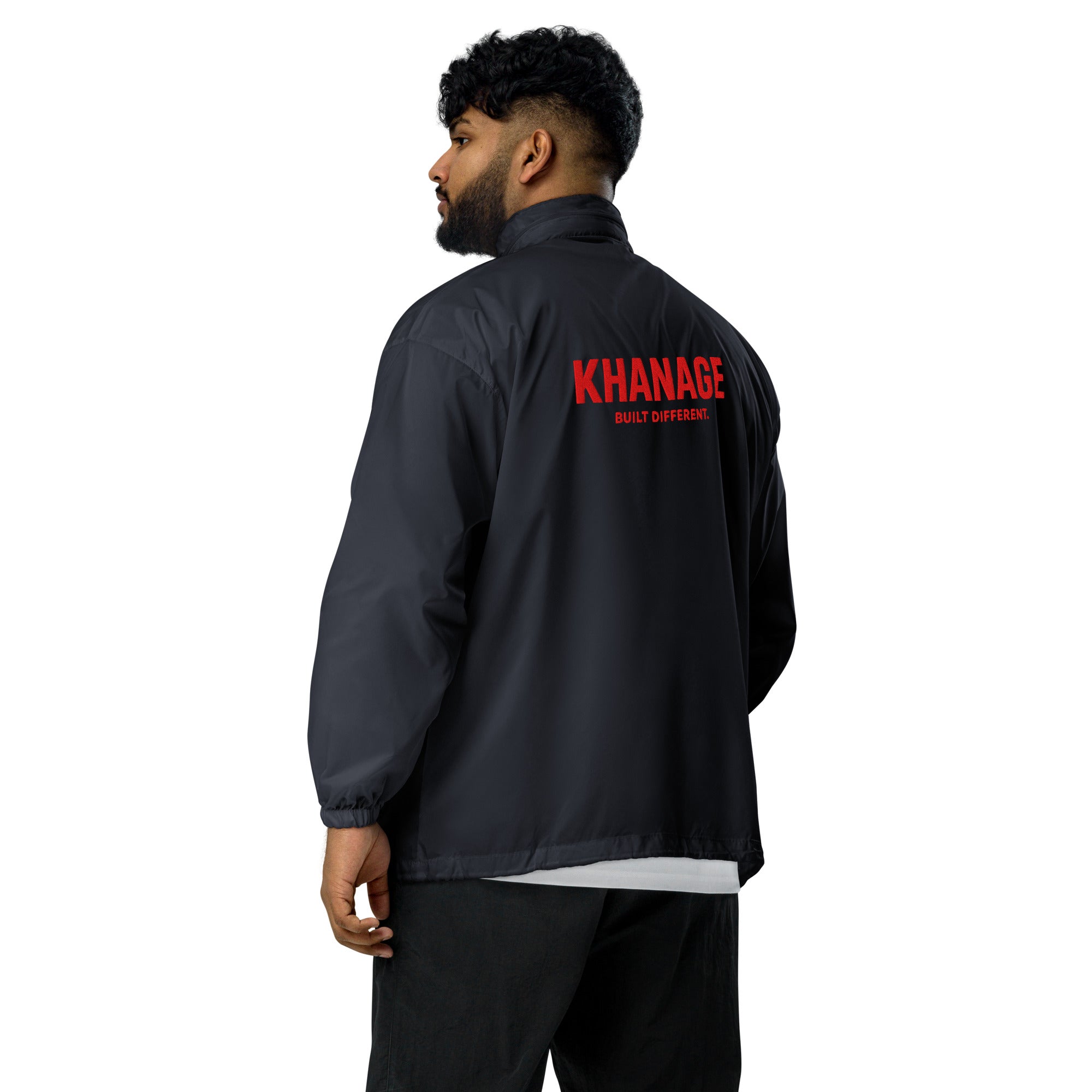 Rear view of KHANAGE Collective red logo unisex windbreaker — navy