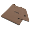Close-up of Built Different graphic on KHANAGE heavyweight t-shirt